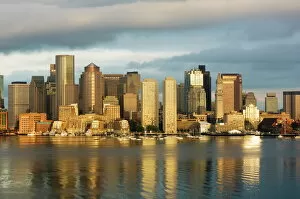 Waterfront Collection: The skyline of the Financial District across Boston Harbor at dawn