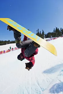 Competition Collection: A snowboarder jumping at Telus Half Pipe competition 2009