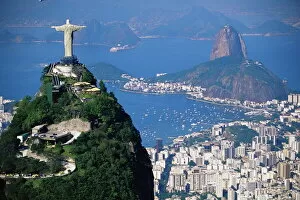 Famous statues Jigsaw Puzzle Collection: Statue of Christ the Redeemer overlooking city and Sugar Loaf mountain