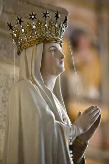 Monuments and landmarks Collection: Statue of Virgin Mary wearing crown inside parish church, Saint-Thegonnec, Finistere
