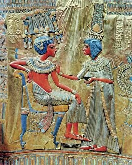 Ancient civilizations Collection: The back of the gold-plated throne, showing queen Ankhesenamun putting the finishing touches to