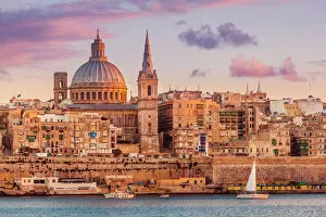 Religious Architecture Poster Print Collection: Valletta skyline at sunset with the Carmelite Church dome and St
