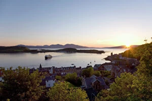 Port Collection: View over Oban Bay from McCaigs Tower, sunset, ferry coming into port, Oban, Argyll and Bute