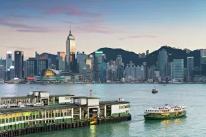 Chinese Fine Art Print Collection: View of Star Ferry Terminal and Hong Kong Island skyline at dusk, Hong Kong, China, Asia