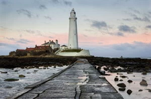 Great Houses Fine Art Print Collection: View along the tidal causeway to St. Marys Island and St. Marys Lighthouse at dusk