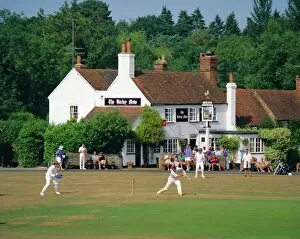 Cricket Collection: Village green cricket, Tilford, Surrey, England, UK