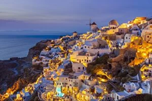 Residential Building Collection: Windmill and traditional houses after sunset, Oia, Santorini (Thira), Cyclades Islands