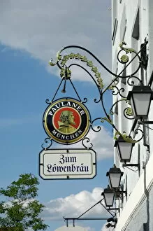 Signs Photo Mug Collection: Wrought iron sign advertising Paulaner and Lowenbrau beer, Wolfrathausen
