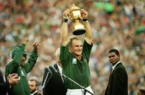 Springbok Metal Print Collection: Francois Pienaar lifts the World Cup for South Africa as Nelson Mandela cheers