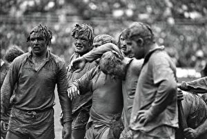 All Blacks Metal Print Collection: Mud-covered British Lions forwards face the Junior All Blacks in 1977