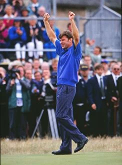 Golf Poster Print Collection: Nick Faldo raises his arms after winning the 1992 Open Championship