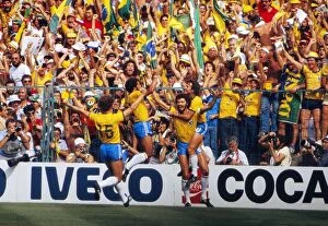 Related Images Poster Print Collection: Socrates celebrates with his teammates after scoring for Brazil at the 1982 World Cup