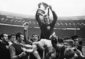 West Ham United Fine Art Print Collection: West Ham United captain Bobby Moore is chaired on his teammates shoulders after victory in