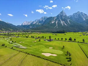 Austria Photo Mug Collection: Aerial view at Ehrwald golf course with Mieminger mountains, Tyrol, Austria