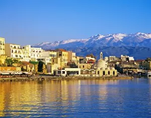 Sunset landscapes Poster Print Collection: Chania waterfront and mountains in background, Chania, Crete, Greece, Europe