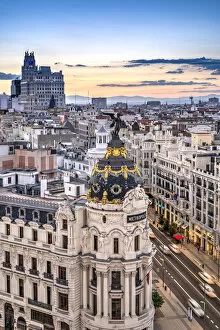 Urban cityscapes Canvas Print Collection: Gran Via and city skyline at sunset, Madrid, Community of Madrid, Spain