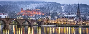 Snowy Collection: Heidelberg castle in winter with the Old Bridge and Church of the Holy Spirit along