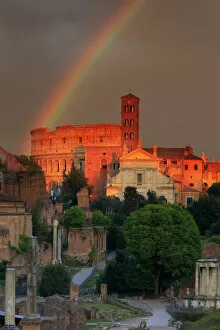 Rainbows Poster Print Collection: Italy, Rome, rainbow over Colosseum and Roman Forum at sunset