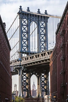 Brooklyn Bridge Poster Print Collection: Manhattan bridge structure framing the Empire State building, Brooklyn, New York, USA