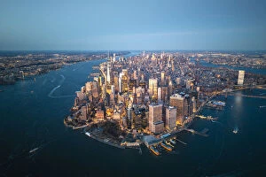 Urban cityscapes Photographic Print Collection: Manhattan, New York City, USA. Aerial view of Lower Manhattan at dusk