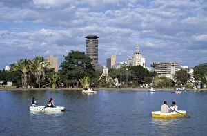 Rowing Boats Collection: The Nairobi skyline from Uhuru Park where city residents