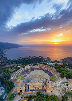 Taormina Collection: Taormina, Sicily. Aerial view of the Greek theater with the sun rising on the sea in the