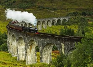 Heritage buildings Collection: UK, Scotland, Highlands, Jacobite Steam Train crossing the Glenfinnan Viaduct