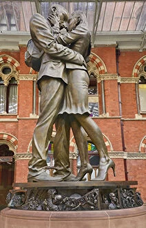 Stations Metal Print Collection: England, London, St Pancras railway station on Euston Road, The Meeting Place statue by Paul Day