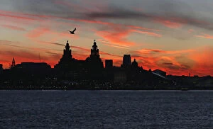 River Mersey Poster Print Collection: The sun rises across the river Mersey over Liverpool