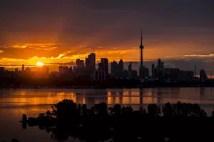 Cityscape paintings Collection: The sun rises over the skyline in Toronto