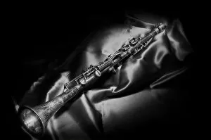 Still life paintings Mouse Mat Collection: A black and white still life image of a brass clarinet