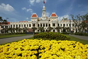 Cultural festivals and traditions Metal Print Collection: Flowers and historic Peoples Committee Building (former Hotel de Ville de Saigon)
