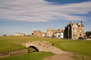 Posters Framed Print Collection: Golfing the special Swilcan Bridge on the 18th hole at the world famous St Andrews