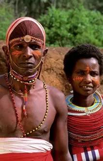 Model Released Collection: Msai tribe people couple in costume traditional dress in jungles near hut near Kenya Africa