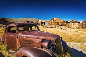 6 Oct 2012 Photo Mug Collection: Rusted car and buildings, Bodie State Historic Park, California USA