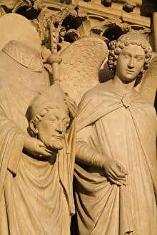 David Barnes Collection: Sculpture on facade of Notre Dame Cathedral of Saint Denis after his martyrdom by decapitation