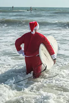 Father Christmas Fine Art Print Collection: Surfing Santas, surfboards, Cocoa Beach, Florida, USA