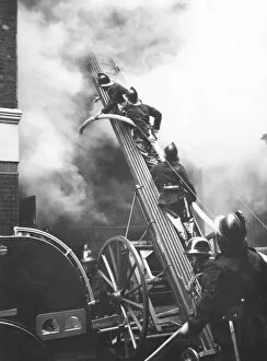Hose Collection: Firefighters in action, Eagle Street, London WC1