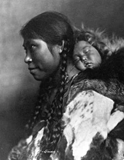 Anthropology Collection: ALASKA: ESKIMOS, c1905. A mother carrying her sleeping child on her back, Nome, Alaska