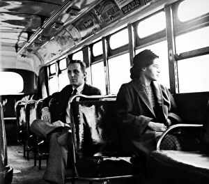 Seated Collection: American civil rights advocate. Parks sits at the front of a public bus (formerly whites only)