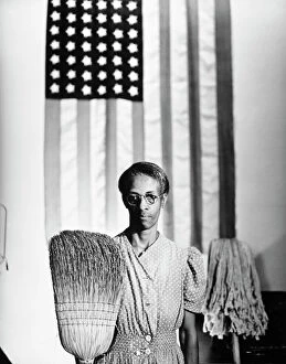 Parks Collection: AMERICAN GOTHIC, 1942. Ella Watson, a US Government Chairwoman. Photograph by Gordon Parks, 1942