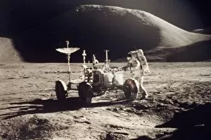 Apollo 15 Collection: APOLLO 15, 1971. Jim Irwin standing by the lunar rover, Mount Hadley in the background