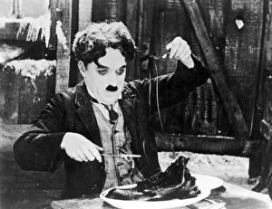 Courtesy Title Collection: CHAPLIN: THE GOLD RUSH. Charlie Chaplin in a scene from The Gold Rush, 1925