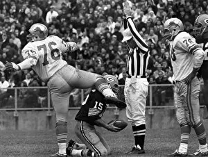 Defender Collection: FOOTBALL GAME, 1965. Defensive tackle Roger Brown of the Detroit Lions exults after sacking