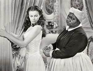 Movie Star Collection: GONE WITH THE WIND, 1939. Hattie McDaniel assists Vivien Leigh while offering some unwelcomed advice