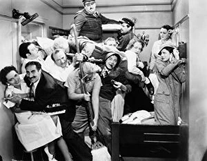 Related Images Photographic Print Collection: THE MARX BROTHERS, 1935. Some of the ships crew join the Marx Brothers in their cabin in A Night