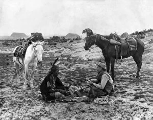Plains Mouse Metal Print Collection: PLAYING CARDS, c1915. A cowboy and a Native American man seated on a blanket