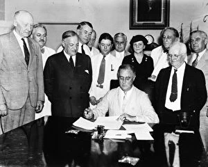 Franklin Collection: President Franklin D. Roosevelt signing the Social Security Act in the Cabinet Room of the White