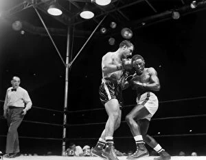Charles Smith Mouse Mat Collection: Rocky Marciano (left) defending his heavyweight title in a fight against Ezzard Charles at Yankee