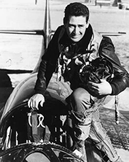 1943 Collection: TED WILLIAMS (1918-2002). American baseball player. Photographed in the cockpit of a Grumman F9F-6